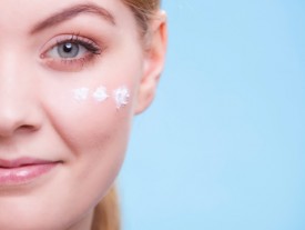 Young woman's face with moisturizer